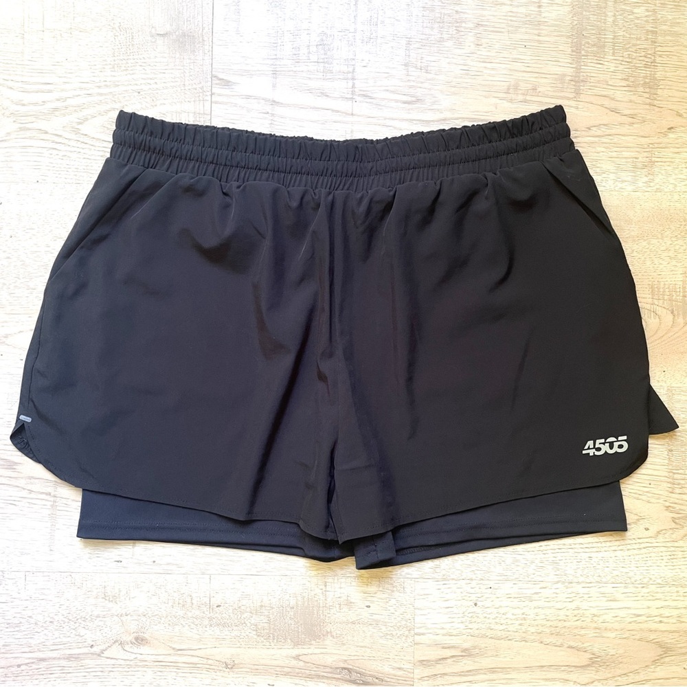 NWOT ASOS 4505 Women’s Shorts size 14. Black. Built in shorts. Drawstring